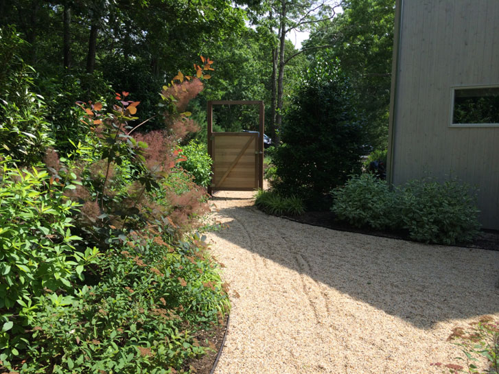 backyard landscape design, gravel walkway with plants