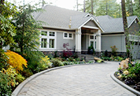 View of the new paved driveway entry design by Vanessa  Gardner Nagel